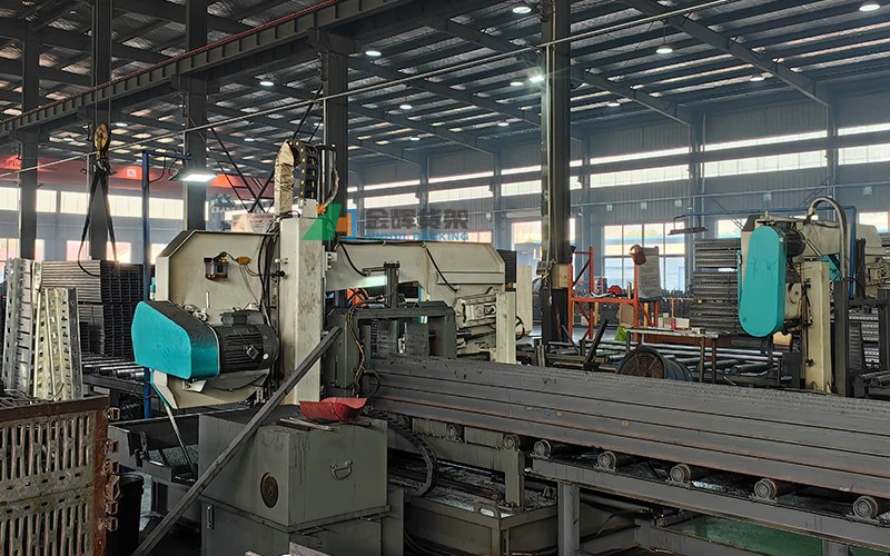 Heavy-duty metal sheet/beam processing machine in workshop Heavy-duty metal sheet/beam processing machine in workshop